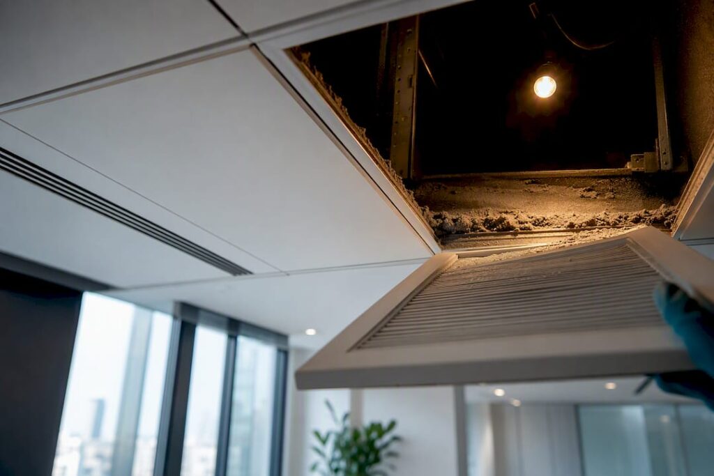 Dusty office return-air plenum before inspection